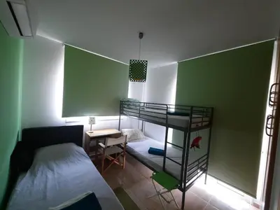 a bedroom with a bunk bed and a bunk room with a bed at Villa Anastassia in Ayia Napa
