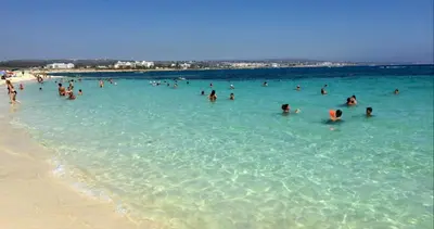 a group of people in the water at the beach at Panthoma Casa in Ayia Napa