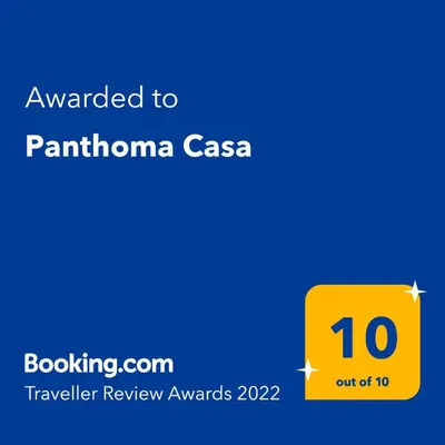 a yellow sign with the text awarded to pantonia casas at Panthoma Casa in Ayia Napa