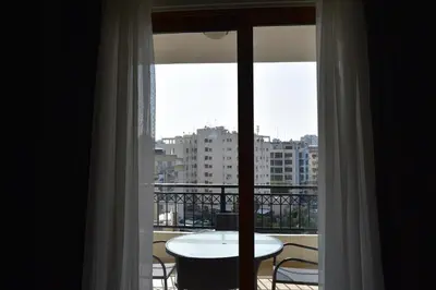 a view of a balcony with a table and a window at Klimentos Flat 59 in Nicosia