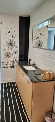 a bathroom with a sink and a mirror at Villa Larnaca Bay Resort in Voroklini