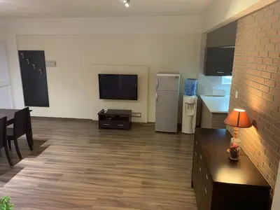 a room with a kitchen and a dining room at Kika Court 2 in Paralimni