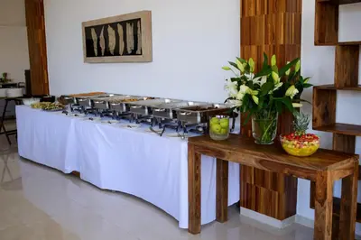 a buffet line with trays of food on it at Crystal Hotel in Kakopetria