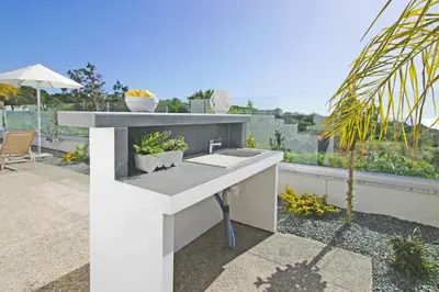 a white counter with a sink on a balcony at Villa Napa View in Ayia Napa