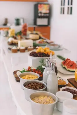 a buffet with many plates of food on a table at TSANotel in Limassol