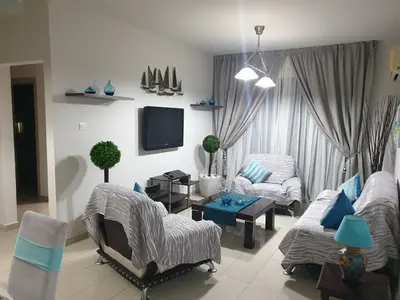 a living room with a couch and a tv at Casa Di Gio in Tersephanou