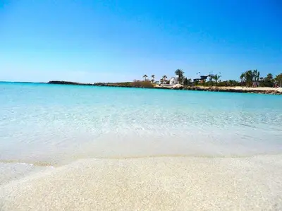 a view of a beach with the blue water at NISSI BEACH Apt 7 BIG VERANDA AND FREE WIFI in Ayia Napa