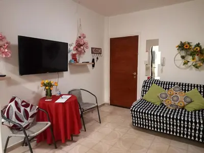 a living room with a couch and a table at Artemis Boutique Apartment 2 in Limassol