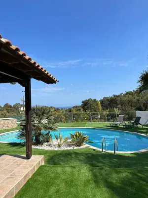 a swimming pool in the middle of a yard at Leo's Paradise in Protaras
