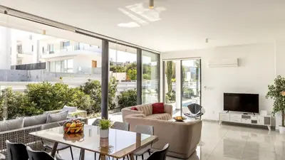 a living room with a couch and a table at Diamond villas in Protaras