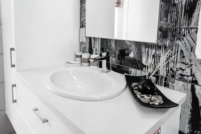 a bathroom with a white sink and a mirror at Seafront Villa Maya by Ruidoso Luxury in Ayia Napa