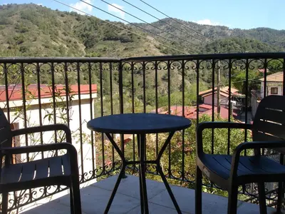 a table and chairs on a balcony with a view at Love Holiday Suite 2 in Tris Elies