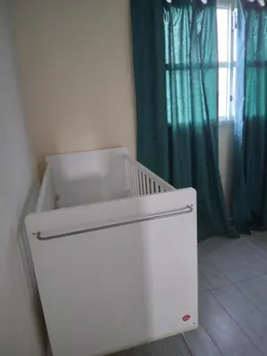 a white crib in a room with a window at MERSINERA PARADISE GARDEN STARS HOUSE in Larnaka