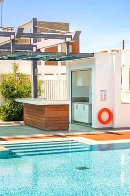 a house with a swimming pool next to a house at Villa Dione by Ruidoso Luxury in Ayia Napa