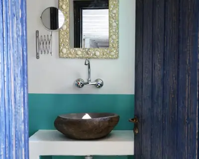 a bathroom with a wooden sink and a mirror at Apokryfo Traditional Guesthouse in Lofou