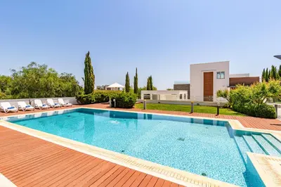 a swimming pool in a backyard with a house at Villa Marsali by Ruidoso Luxury in Ayia Napa