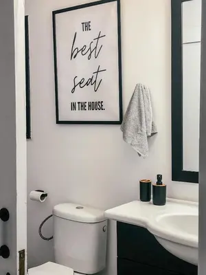 a bathroom with a toilet and a picture on the wall at Milea Mansion in Limassol
