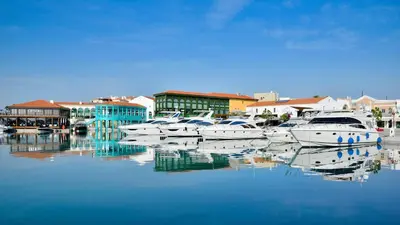 a group of boats are docked in a harbor at Seafront - 2 bedroom Modern in Limassol