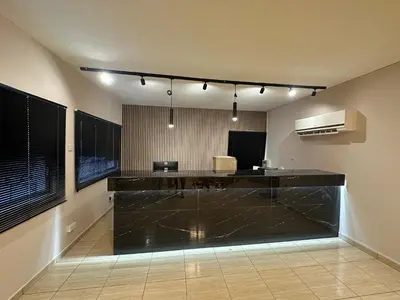 an office with a black counter top in a room at Sun Plaza Suites - Adults Only in Ayia Napa