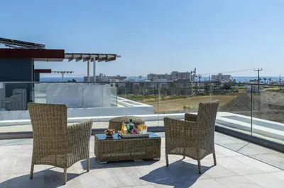 a group of chairs and a table on a roof at Protaras Royal Pearl Villa 7 in Protaras