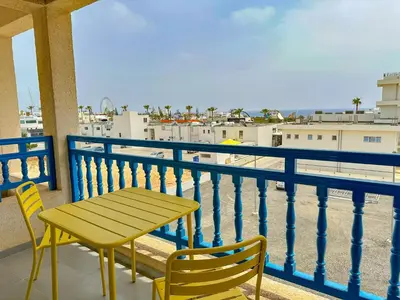 a table and chairs on a balcony with a view at Lovely Studio Ayia Napa in Ayia Napa