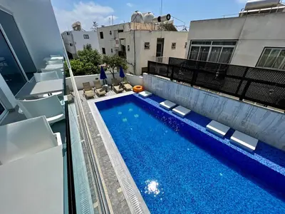 a swimming pool on the roof of a building at Sunny Blue Hotel in Ayia Napa