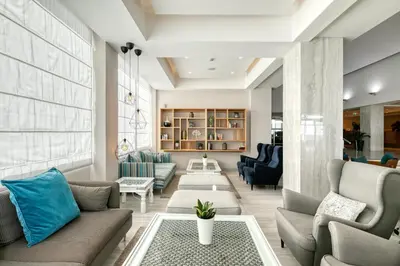 a living room with couches and a table at Atlantica Sea Breeze, Adults Only in Protaras