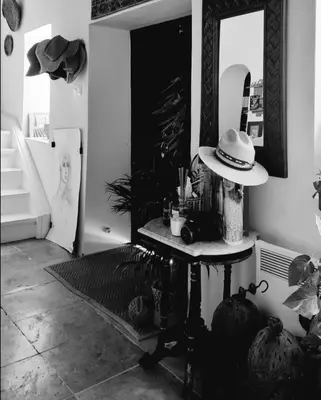 a room with a table with a hat on it at Casa BOHO in Alaminos