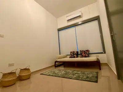 a living room with a bench and a window at Central Suites Down Town Nicosia in Nicosia