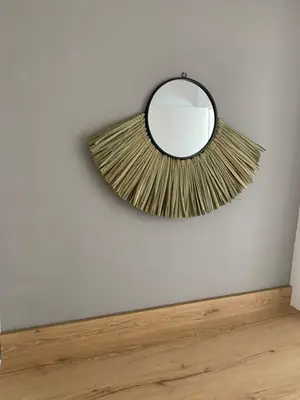 a mirror on a wall with a wooden floor at KSQUARED in Protaras