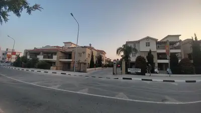 an empty street with houses on the side of the road at Pyla Gardens A202 Studio in Pyla