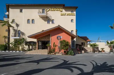 a large building with a sign on the side of it at Anais Bay Hotel in Protaras