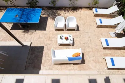 an overhead view of a patio with chairs and a table at Mylos 9 in Protaras