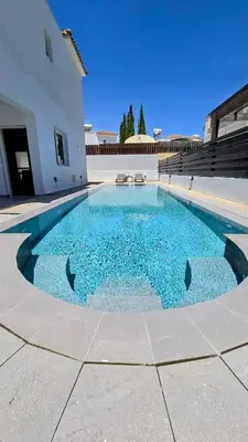 a swimming pool in the middle of a house at Sweet Destiny Villa with private pool in Ayia Napa