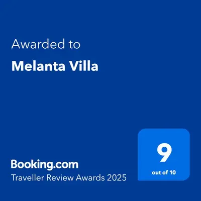 a screenshot of a cell phone with the text awarded to melania villa at Melanta Villa in Pissouri