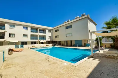 a swimming pool in front of a building at MyHome DeLux, Ayia Napa 3 Bedroom with Pool in Ayia Napa