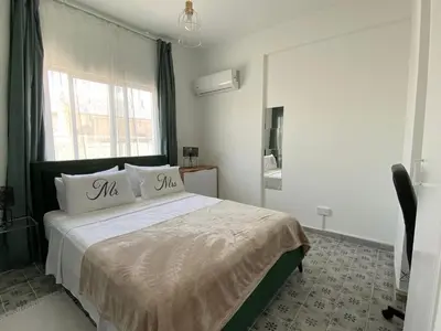 a bedroom with a bed with two pillows on it at Simple One bedroom flat in Engomi in Engomi