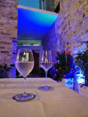 two wine glasses sitting on top of a table at 7Kamares in Pano Lefkara