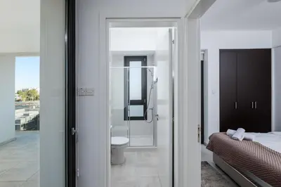 a bathroom with a shower and a toilet in a room at Solaar Apartments st Lazarous in Larnaka