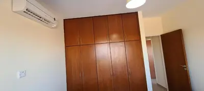 a large wooden cabinet in a room with a ceiling at STAY Trinity Beach Apts in Paralimni