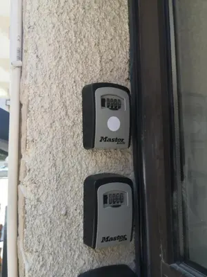 two clocks on the side of a wall at St Lazaros, Larnaca Center Studio in Scala