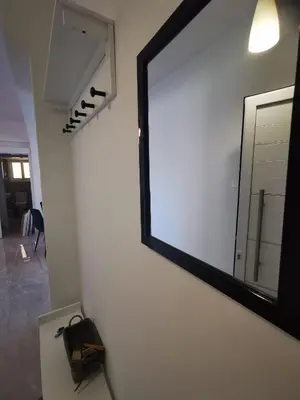 a large mirror on a wall in a room at Hawaii Holiday Apartment 41 in Limassol