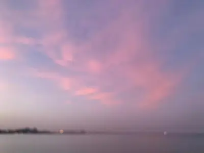 a cloudy sky over the water with the ocean at Central Large 2BD APT near the Beach in Larnaka