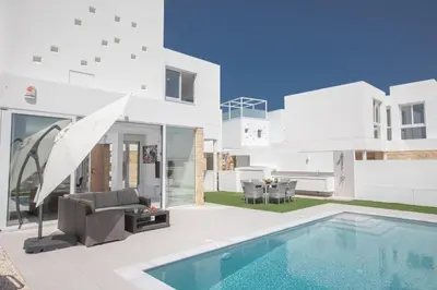 a villa with a swimming pool and a house at Walk to Protaras Center & Beach- Your Dream Escape, Blue Island Villa in Protaras