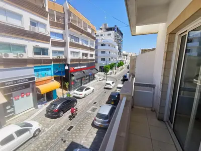 a view of a city street with cars parked on the street at FlipFlop City Center Apartment in Larnaka