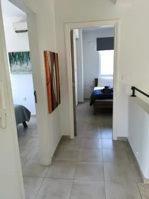 a hallway with a view of a room at Villa Alba, Luxury 4 BDRM Villa with Heated Pool in Protaras