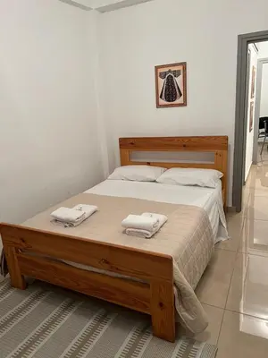 a bedroom with a bed with two towels on it at ARTEMIS 1 Bdr Down Town Nicosia in Nicosia