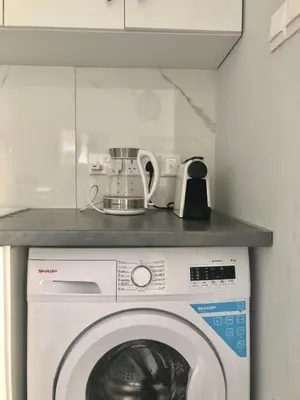 a washing machine with a counter on top of it at Cozy Apartment by the sea in Limassol