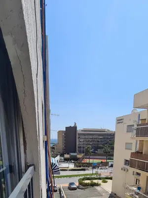 a view of a city from a window of a building at Cozy Apartment by the sea in Limassol