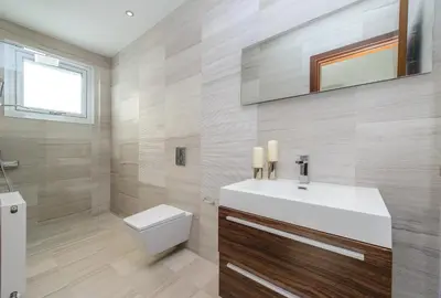 a bathroom with a white sink and a toilet at Bay View Villa in Protaras